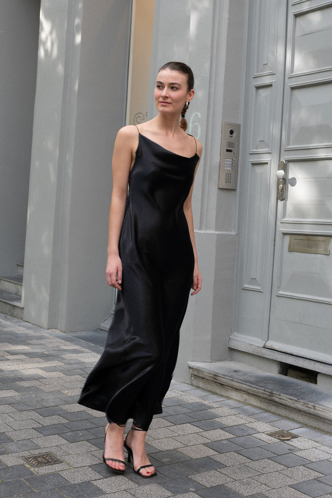 The Elizabeth Maxi Dress by Anna October is a flowing evening dress with an open back