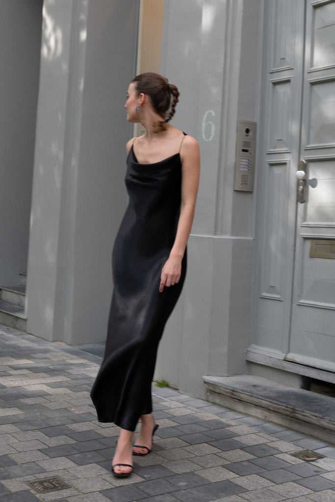 The Elizabeth Maxi Dress by Anna October is a flowing evening dress with an open backThe Elizabeth Maxi Dress by Anna October is a flowing evening dress with an open back