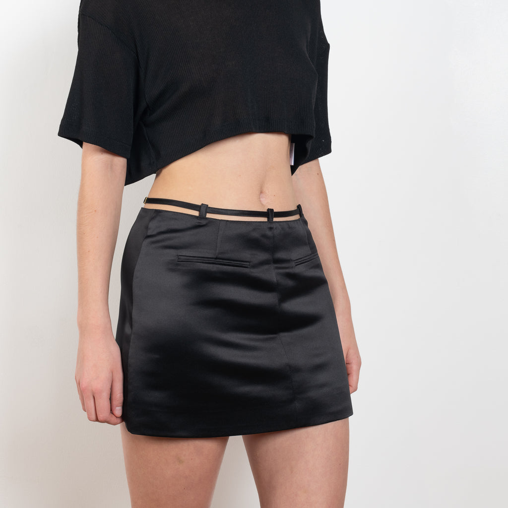 The Keren Mini Skirt by Anna October is a satin mini skirt with a lingerie inspired straps in the waist
