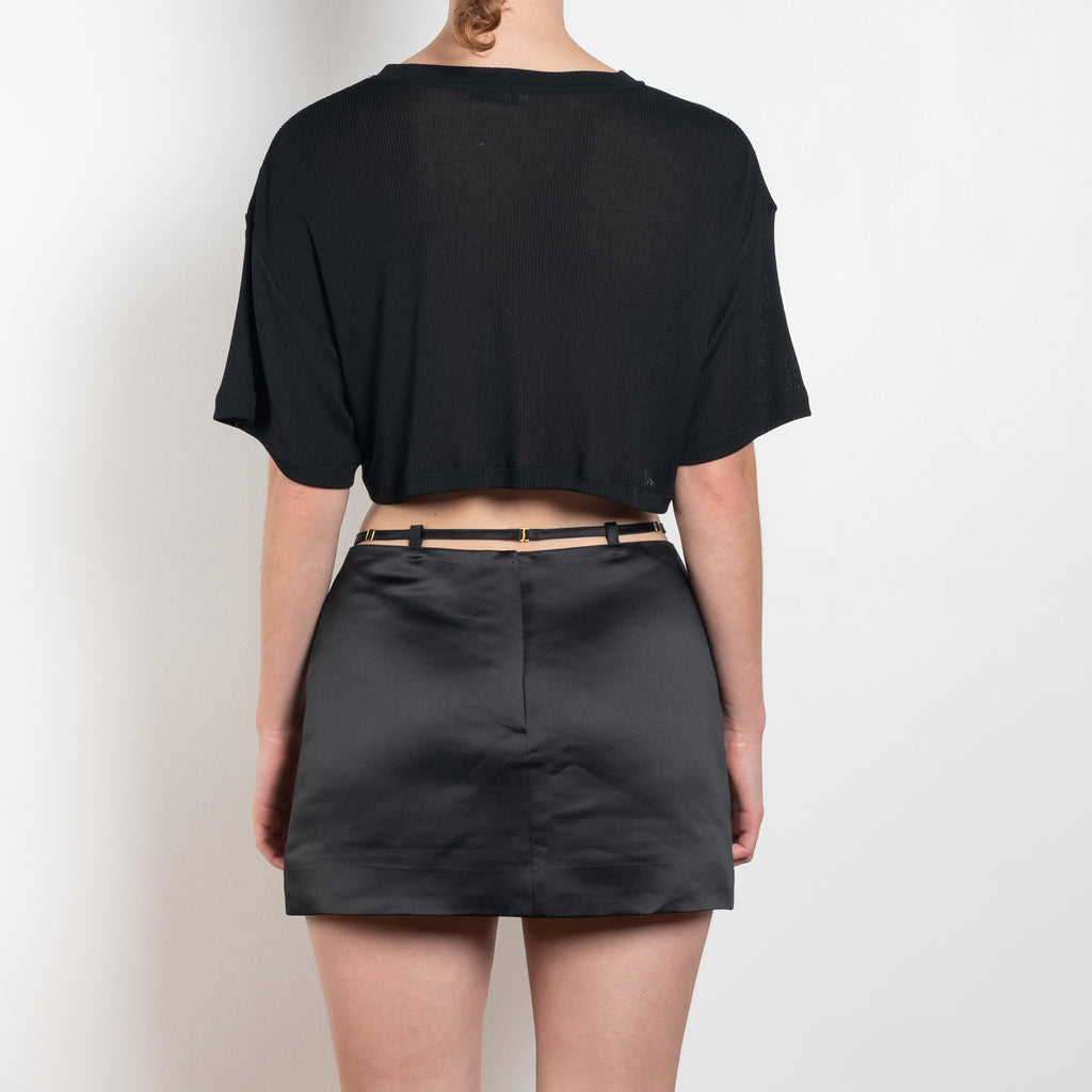 The Keren Mini Skirt by Anna October is a satin mini skirt with a lingerie inspired straps in the waist