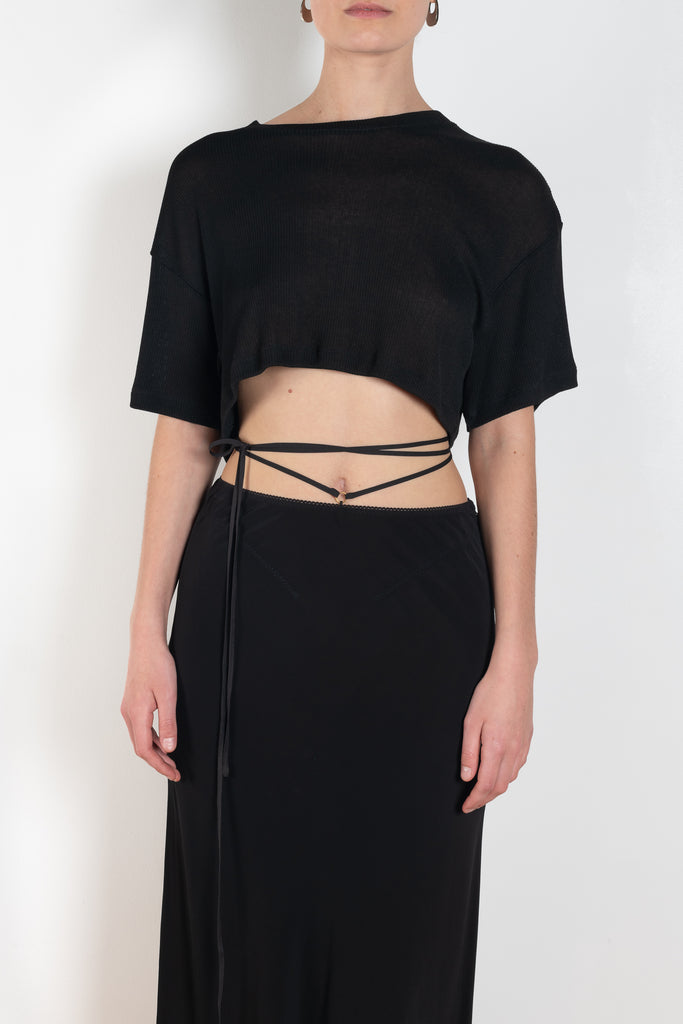 The Voleta Midi Skirt by Anna October is a signature summer skirt with a bias cut and delicate straps on the hips