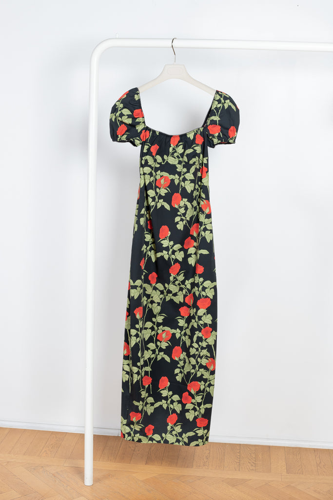 The Dress Rupert by Bernadette is a lightweight cotton summer dress with a fitted silhouette, cap sleeves and a lowered neckline