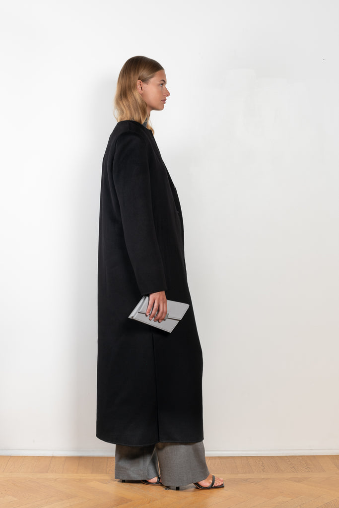 The Martil Coat by Loulou Studio is a straight long buttoned coat with minimal lines and a round neck