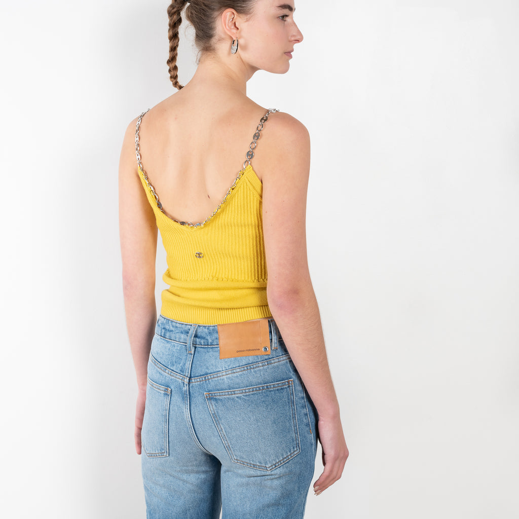 The Chain Top by Paco Rabanne is a bright yellow top with a chain collar in a soft lightweight merino wool blend
