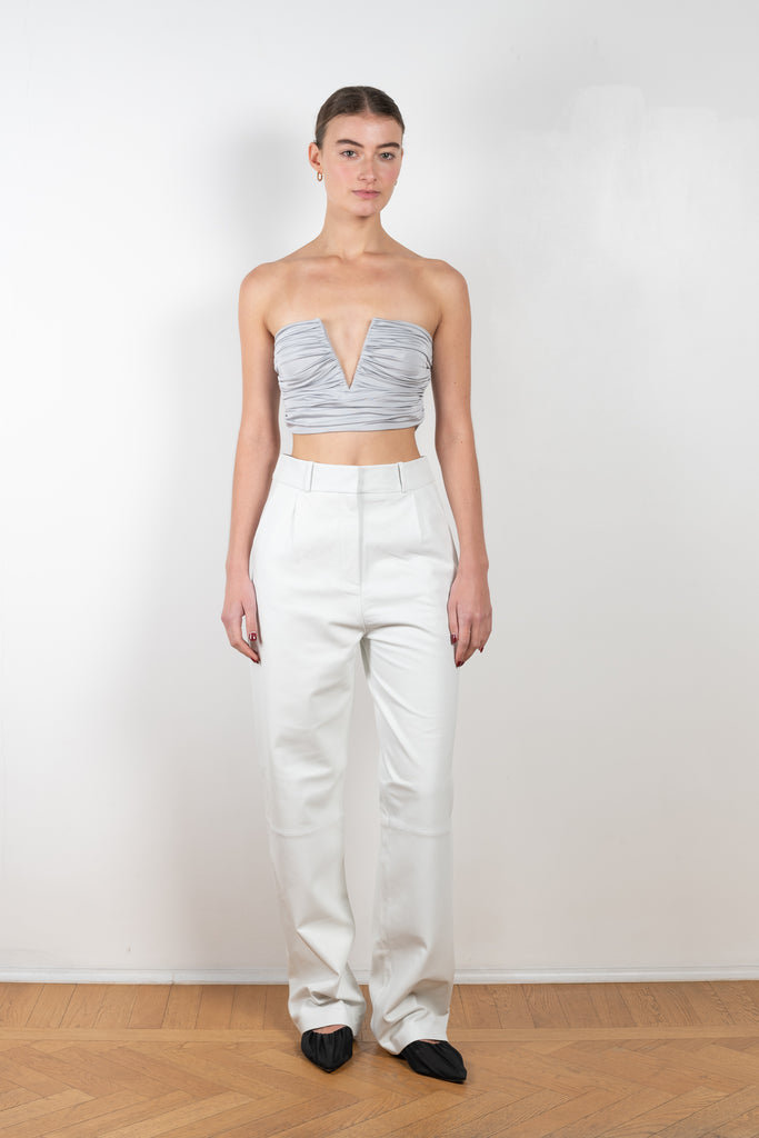 The Sesis Top by GAUGE81 is a minimal bustier top with ruching creating waves and a bold V neck