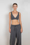 The Capucine Bralette by Lisa Yang is a pull-over piece that is secured with an elasticated band and fitted straps