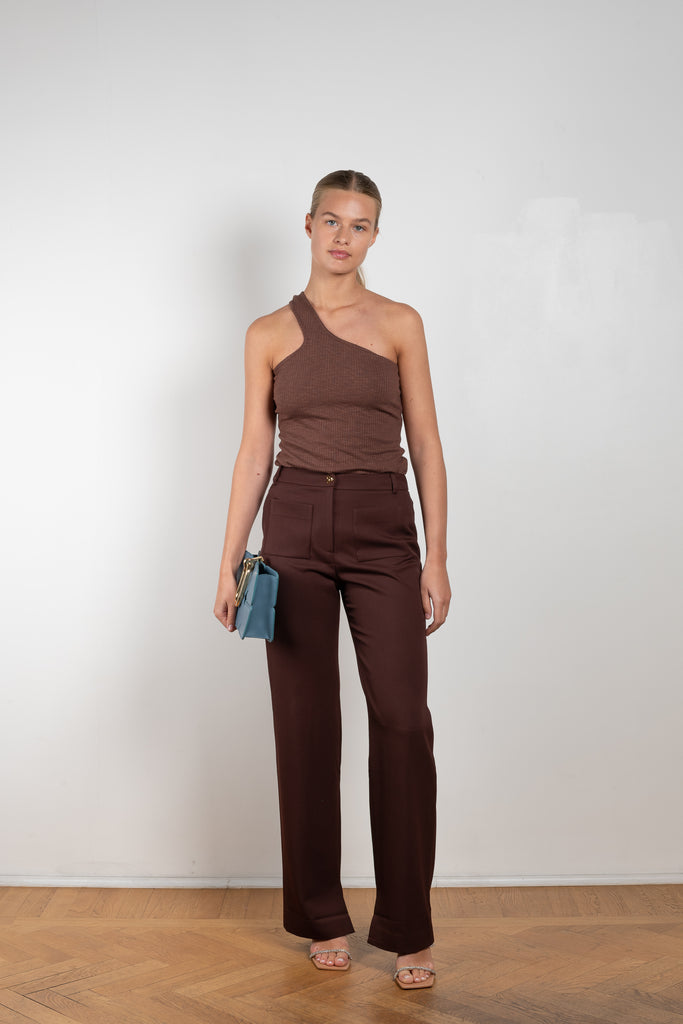 The Ellis Trousers by Rejina Pyo is a high waisted suiting trouser with a straight leg and signature button in a wool twill blend