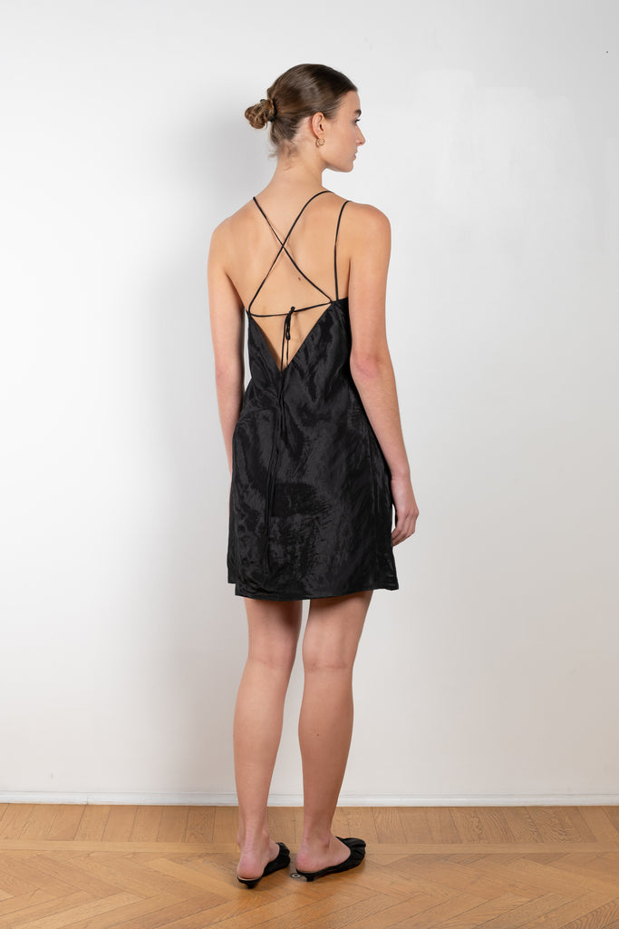 The Sabine Dress by Rejina Pyo is a made in a crinkle viscose blend with an asymmetrical front slit, an adjustable back tie and custom hardware