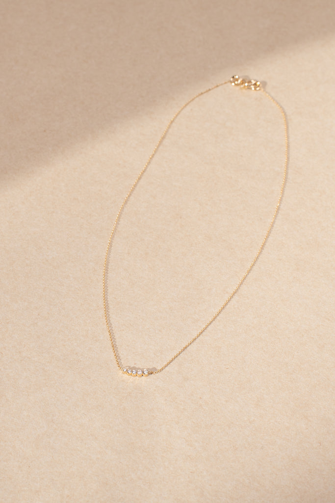 The Lune Necklace by Sophie Bille Brahe is a fine 18Kt Gold necklace with diamonds graduating from small to large