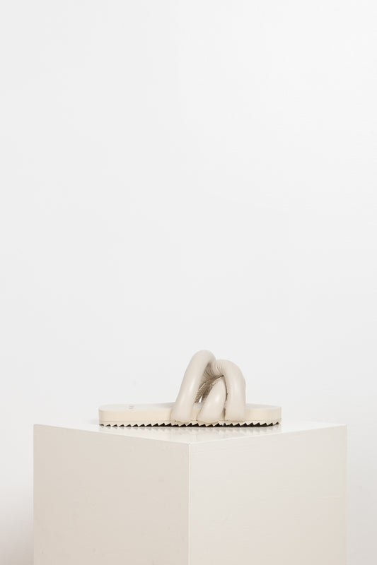 The Tyre Slides by Yume Yume are relaxed slides with chunky straps all over the front foot in beige
