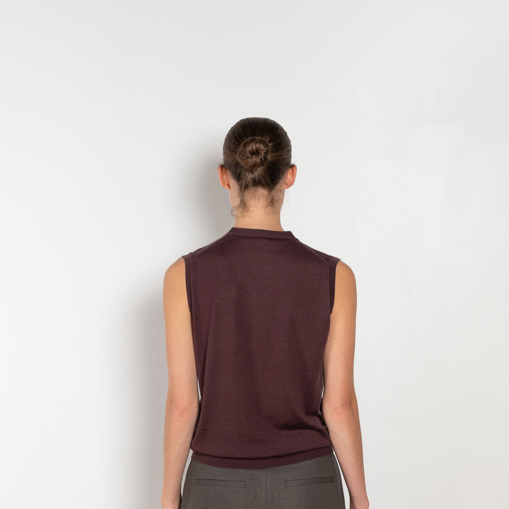 The Button Vest by 6397 is a sleeveless cashmere vest with buttons, a perfect layering piece