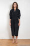 The Collarless Shirtdress by 6397 is a superfine cotton dress with a soft sheerness and full button closure