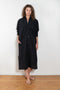The Collarless Shirtdress by 6397 is a superfine cotton dress with a soft sheerness and full button closure