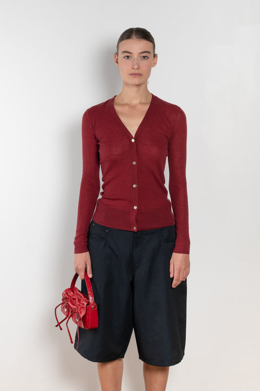 The Skinny Rib Cardigan by 6397 is a slightly sheer wool ribbed cardigan