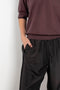 The Inside Out Drawstring Pant by 6397 in silk habotai has a subtle monochromatic print with 'inside out' finishing