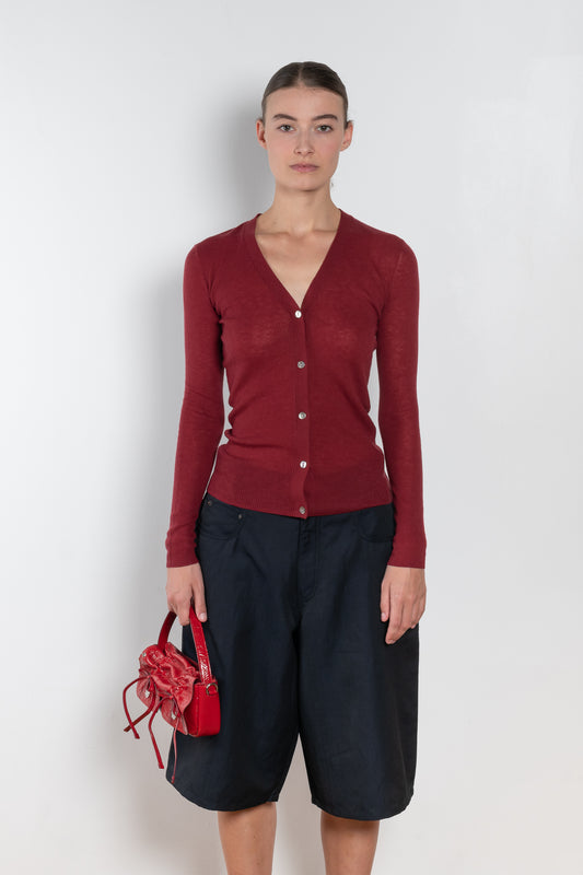 The Skinny Rib Cardigan by 6397 is a slightly sheer wool ribbed cardigan, a feminine piece to be worn as a top