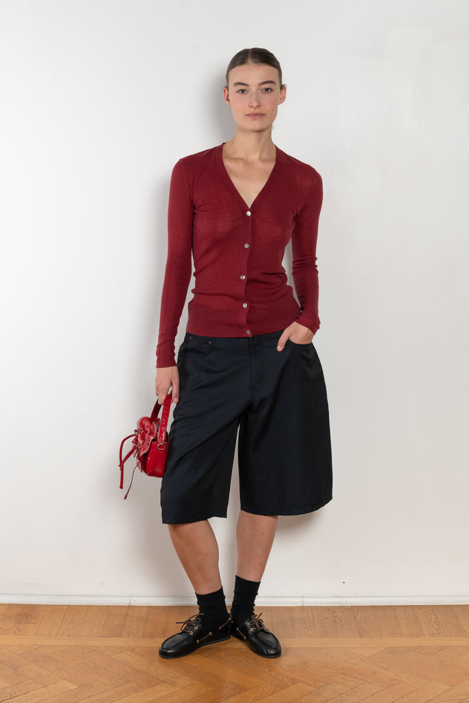 The Skinny Rib Cardigan by 6397 is a slightly sheer wool ribbed cardigan, a feminine piece to be worn as a top