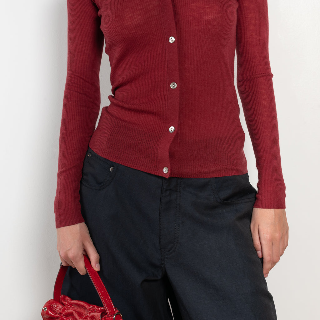 The Skinny Rib Cardigan by 6397 is a slightly sheer wool ribbed cardigan, a feminine piece to be worn as a top