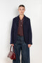 The Boiled Pinstripe Blazer by 6397 is a fitted buttoned jacket in a boiled wool with a delicate pinstripe pattern