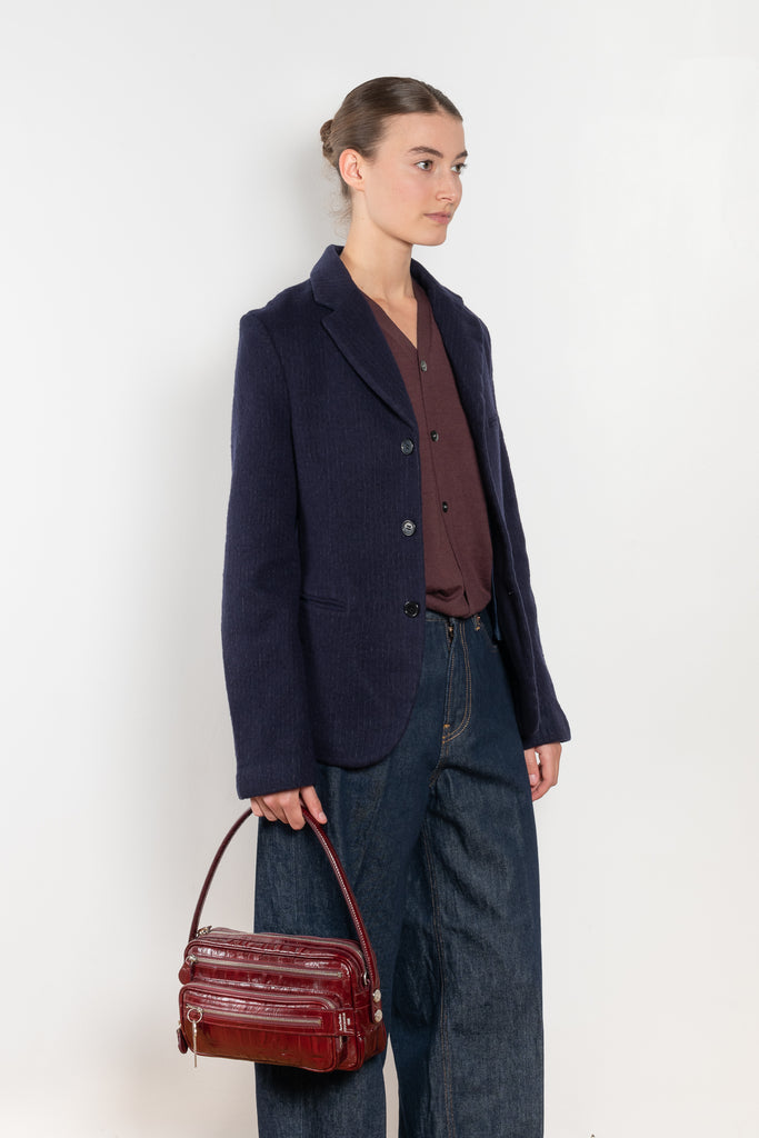 The Boiled Pinstripe Blazer by 6397 is a fitted buttoned jacket in a boiled wool with a delicate pinstripe pattern