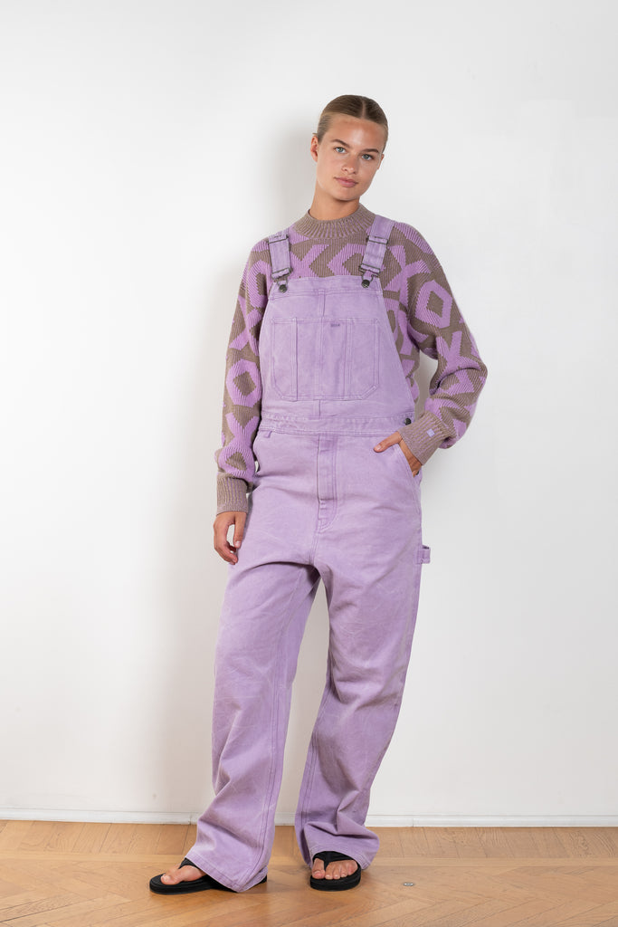 The Canvas Dungarees 86 by Acne Studios are lilac regular unisex overalls with a leather face logo