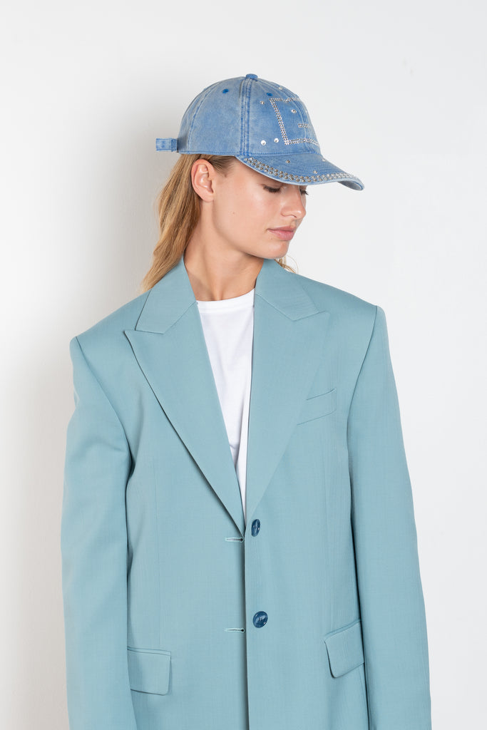 The Crystal Face Logo Cap by Acne Studios is an electric blue six-panel baseball cap crafted from twill cotton with a soft hand feel and washed finish