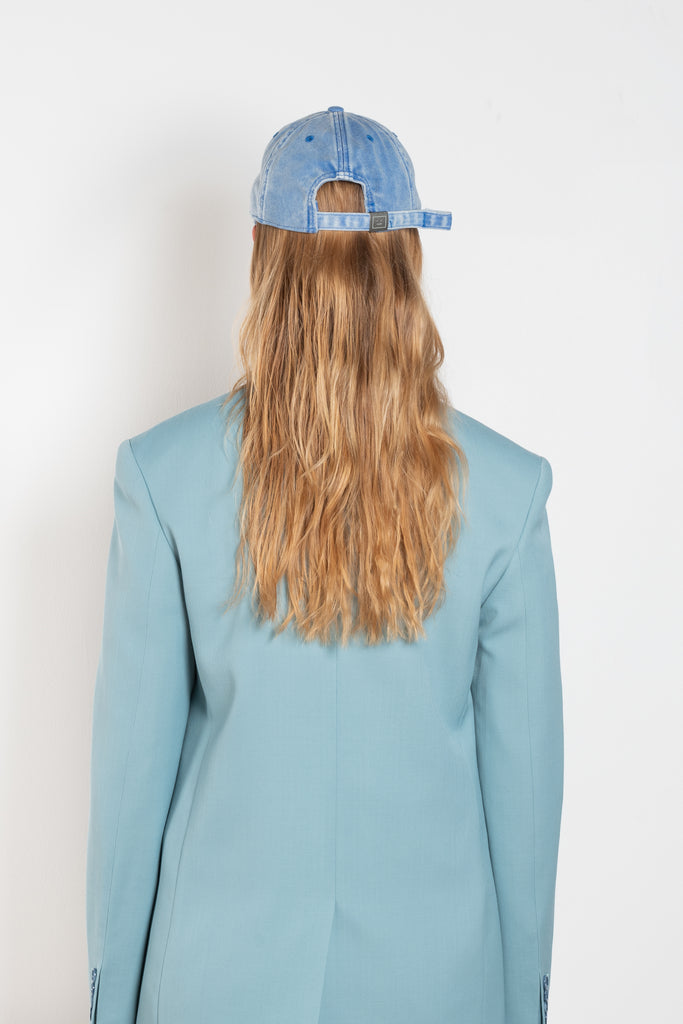 The Crystal Face Logo Cap by Acne Studios is an electric blue six-panel baseball cap crafted from twill cotton with a soft hand feel and washed finish