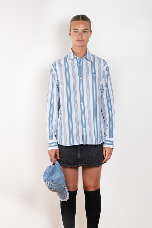 The Striped Shirt 51 by Acne Studios has an all-over stripe pattern and is detailed with a micro face logo embroidery on the chest and a face logo on the back
