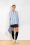 The Striped Shirt 51 by Acne Studios has an all-over stripe pattern and is detailed with a micro face logo embroidery on the chest and a face logo on the back