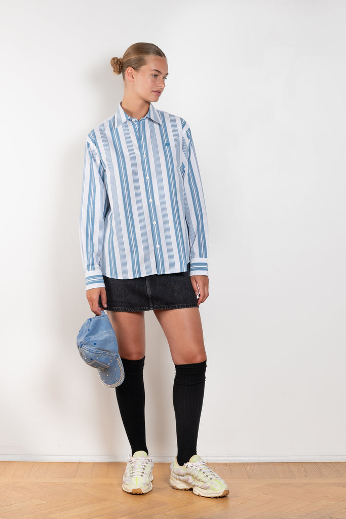 The Striped Shirt 51 by Acne Studios has an all-over stripe pattern and is detailed with a micro face logo embroidery on the chest and a face logo on the back
