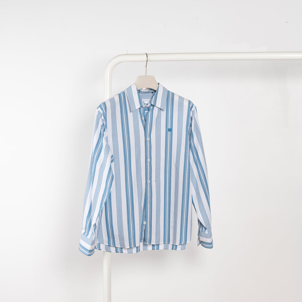 The Striped Shirt 51 by Acne Studios has an all-over stripe pattern and is detailed with a micro face logo embroidery on the chest and a face logo on the back