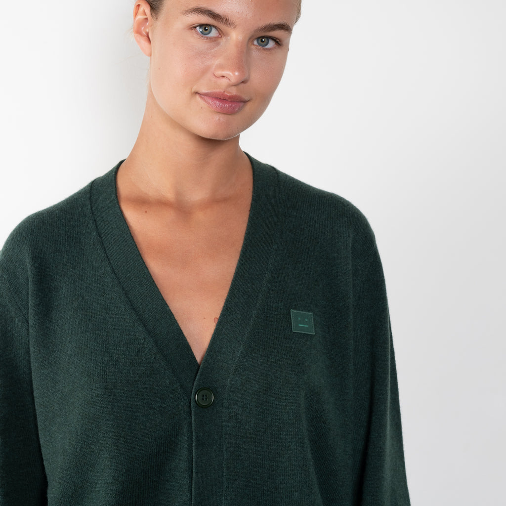 The Face Wool Cardigan 29 by Acne Studios is a signature lightweight wool cardigan with a relaxed fit and small face logo patch