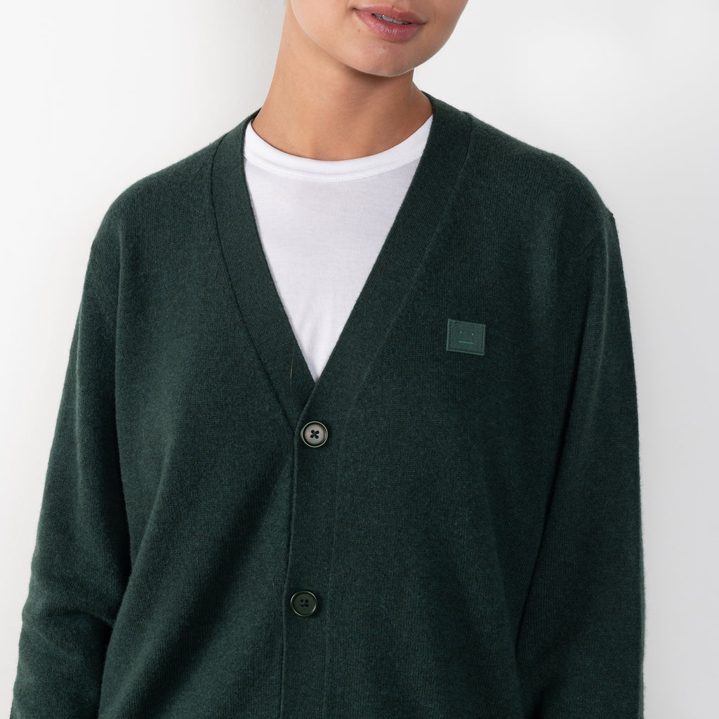 The Face Wool Cardigan 29 by Acne Studios is a signature lightweight wool cardigan with a relaxed fit and small face logo patch