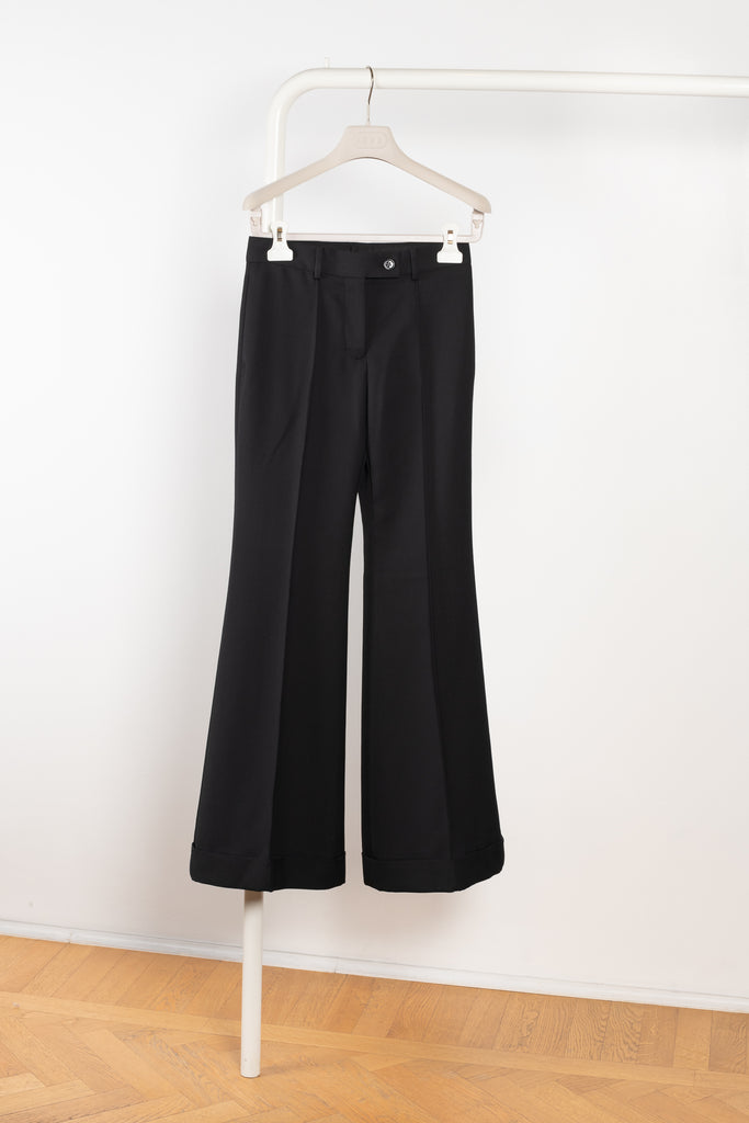 The Flared Trouser 1062 by Acne Studios is a high waisted tailored trouser with flared legs and big cuffs