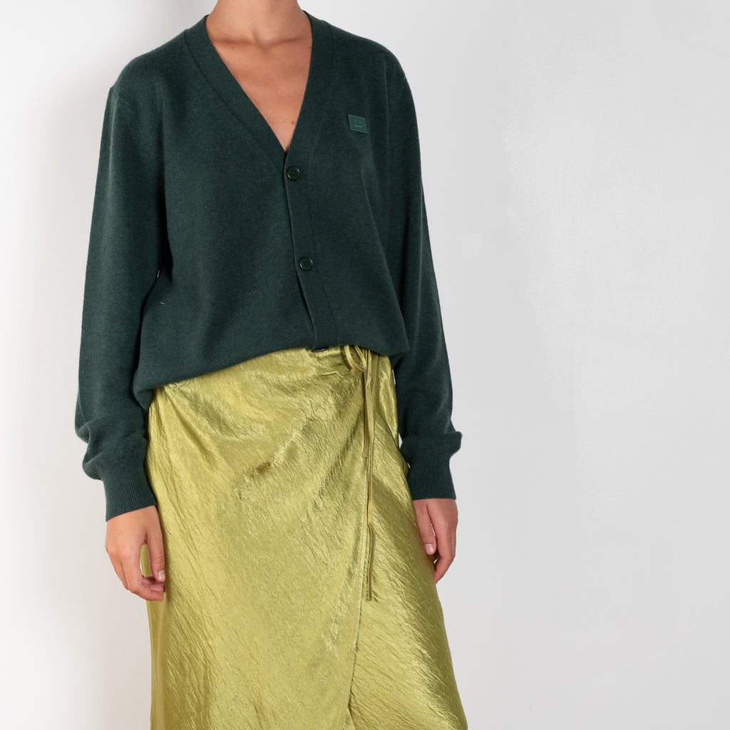 The Satin Wrap Skirt 560 by Acne Studios is made from a satin fabric with a crinkled finish, detailed with a tie-up closure and contrast topstitching
