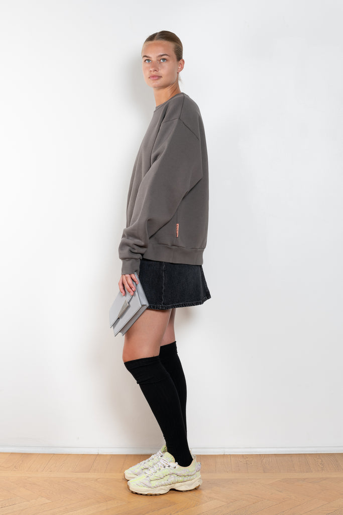 The Denim Mini Skirt 388 by Acne Studios is cut to a relaxed a-line silhouette with a high rise and mid-thigh length