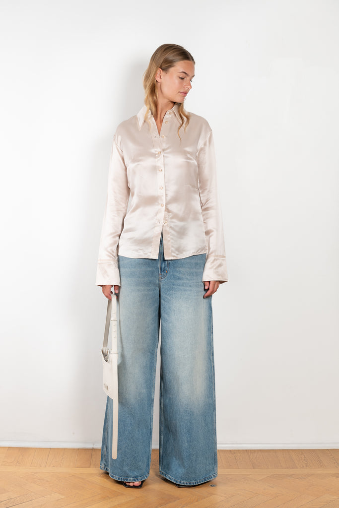 The Silk Shirt 925 by Acne Studios is detailed with contrast fabric raw edges on the collar and cuffs in a fluid silk blend 