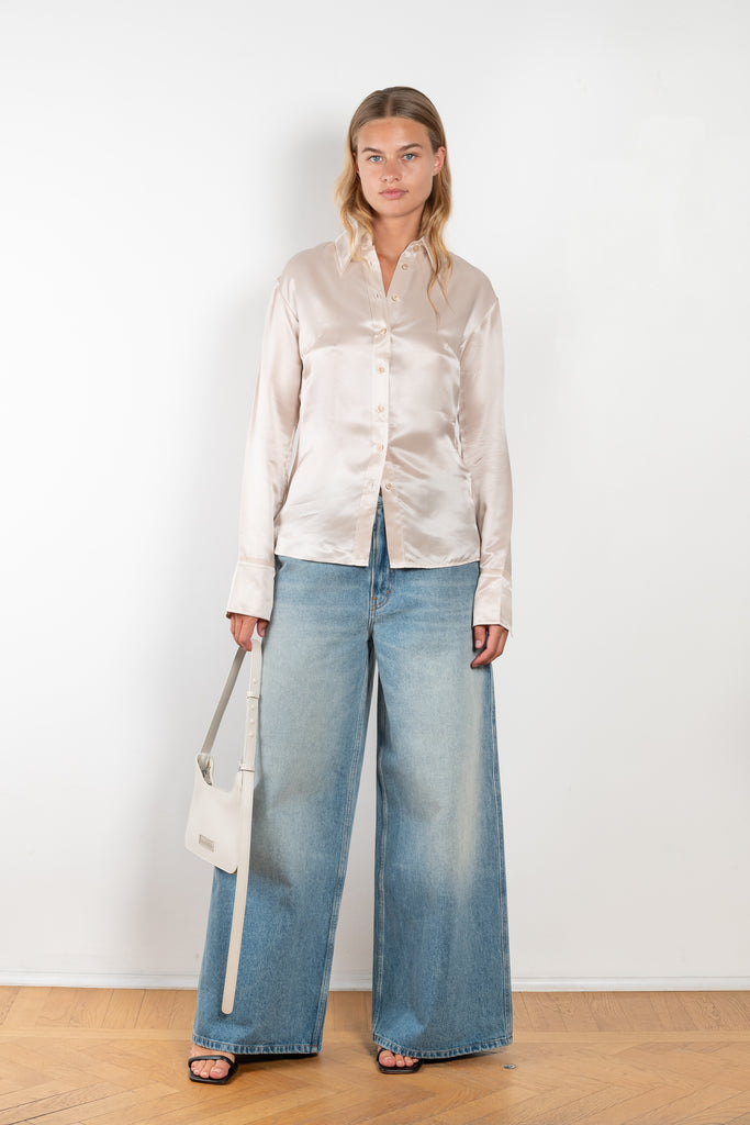 The Silk Shirt 925 by Acne Studios is detailed with contrast fabric raw edges on the collar and cuffs in a fluid silk blend 