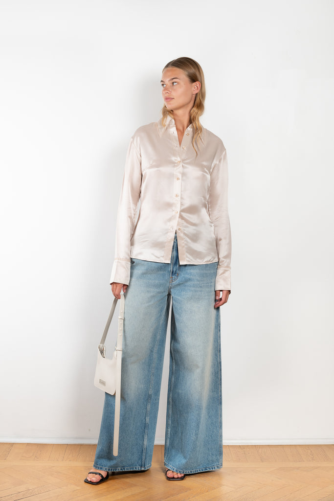 The Silk Shirt 925 by Acne Studios is detailed with contrast fabric raw edges on the collar and cuffs in a fluid silk blend 