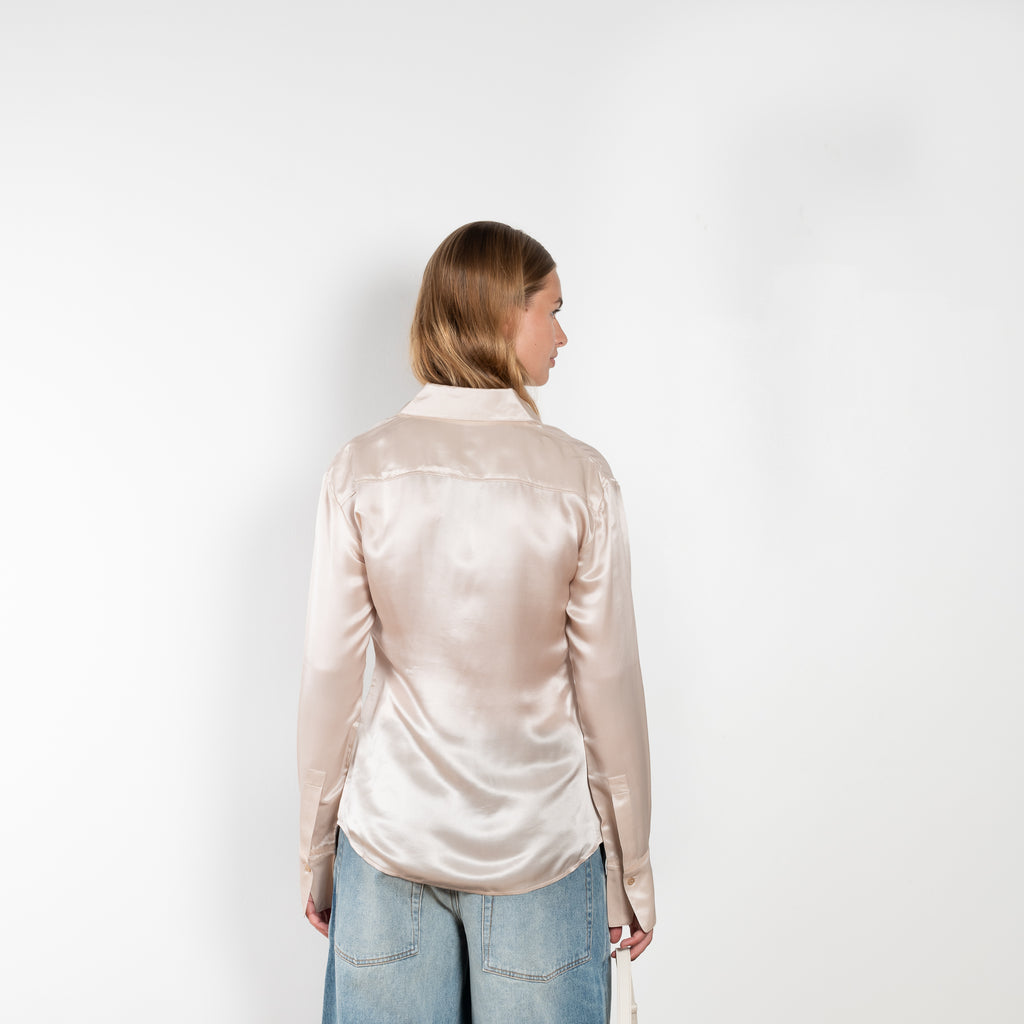The Silk Shirt 925 by Acne Studios is detailed with contrast fabric raw edges on the collar and cuffs in a fluid silk blend 