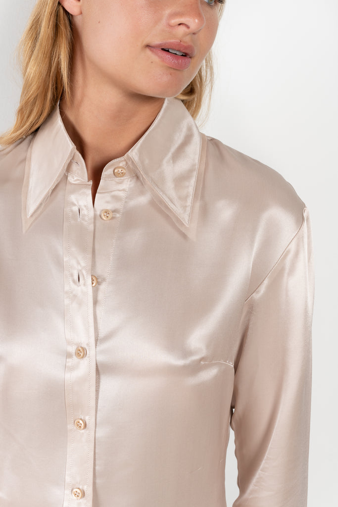 The Silk Shirt 925 by Acne Studios is detailed with contrast fabric raw edges on the collar and cuffs in a fluid silk blend 