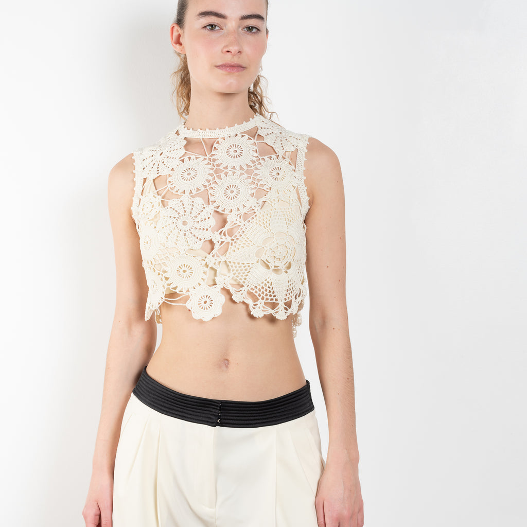 The Giselle Top by Anna October is a delicate cropped lace top with a floral pattern