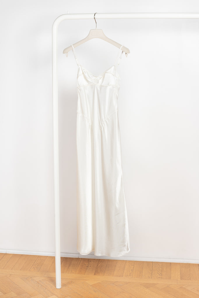 The Waterlily Midi Dress by Anna October is a signature lightweight summer dress with an open back and lingerie details
