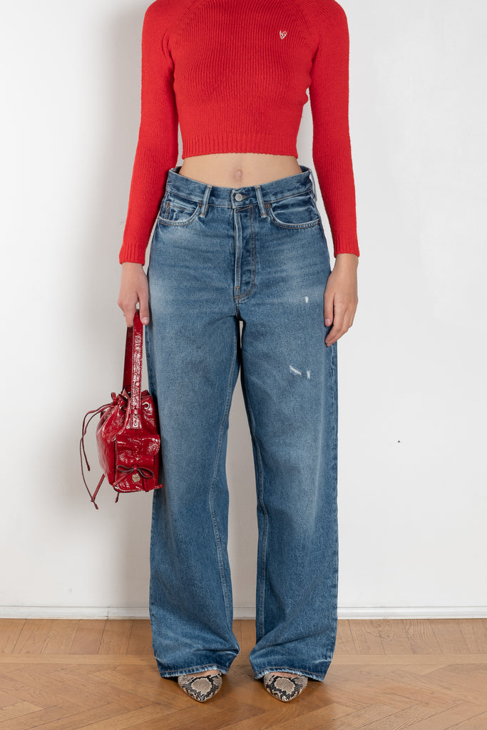 The 1981F Jeans by Acne Studios are cut to a loose fit with a low waist, wide leg and long length