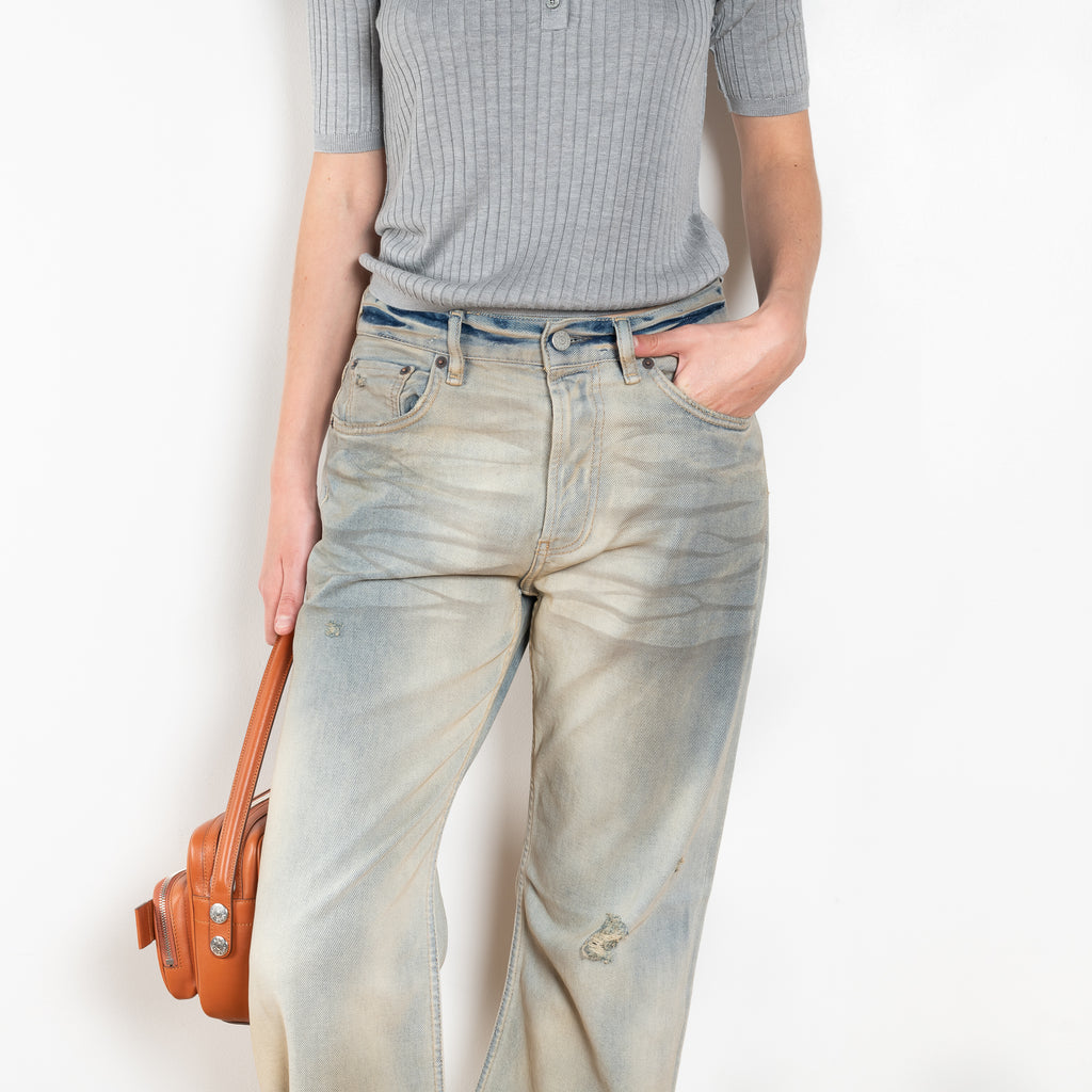 The 2021 Loose Fit Jeans by Acne Studios are cut to a loose fit with mid-waist, wide leg and long length