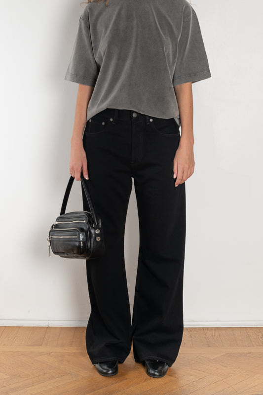 The 2021 Loose Fit Jeans by Acne Studios are cut to a loose fit with mid-waist, wide leg and long length. Made from rigid denim in a black black wash.