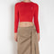 The Belted Twill Skirt by Acne Studios is crafted from classic cotton twill, featuring a trench-style belt at the hip with a leather buckle and embroidered eyelets