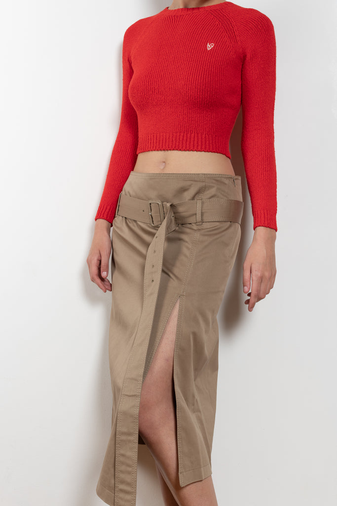The Belted Twill Skirt by Acne Studios is crafted from classic cotton twill, featuring a trench-style belt at the hip with a leather buckle and embroidered eyelets