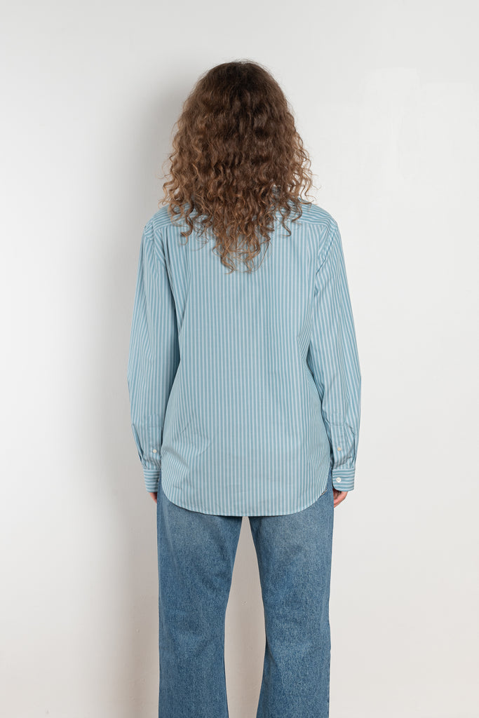 The Button Up Shirt by Acne Studios is a long sleeve button-up shirt with a stripe pattern and contrast collar