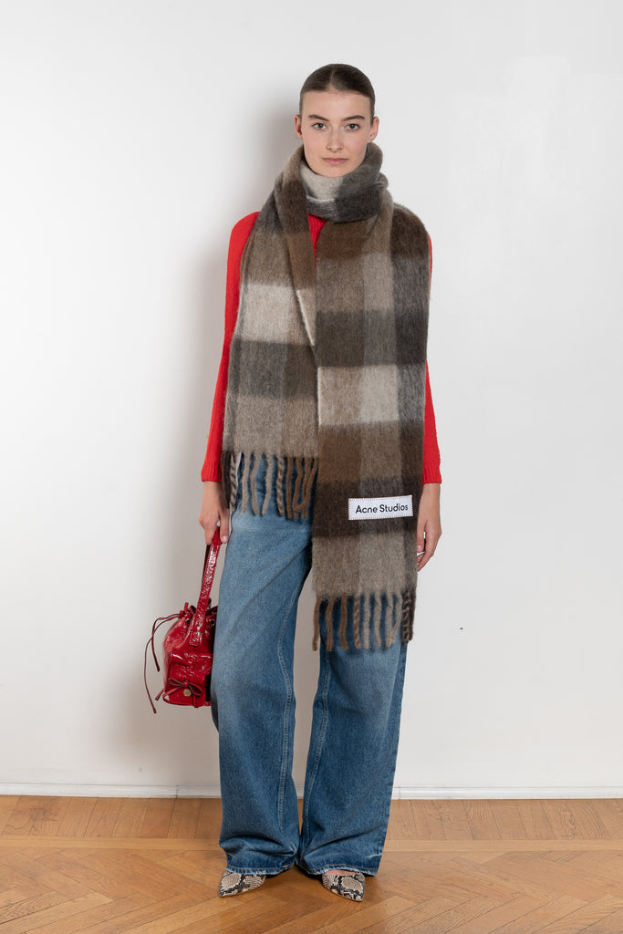 The Mohair Checked Scarf by Acne Studios is crafted from a wool mohair blend detailed with an embroidered logo label.